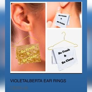 Gold and White Earrings with Text Design